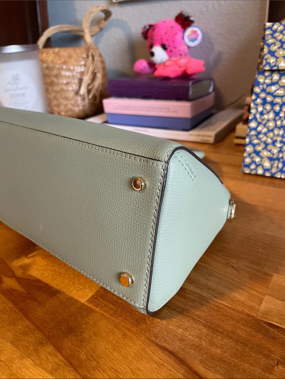 The Kate Spade KK114 refers specifically to the Phoebe East West Satchel